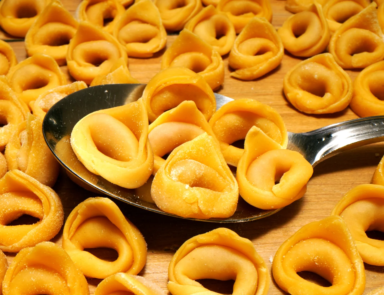 https://www.piattorecipes.com/wp-content/uploads/2021/04/Homemade-Tortellini-Pasta-Recipe-Meat-Tortellini-Recipe.webp